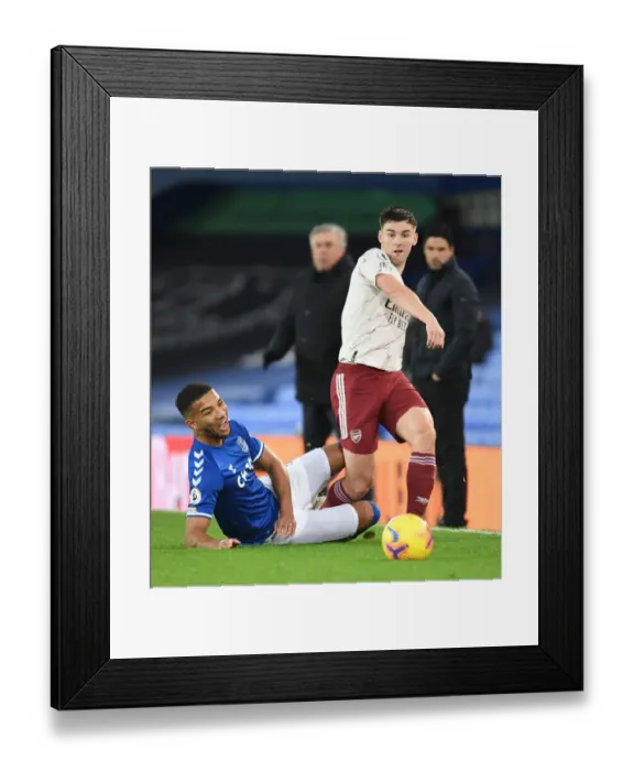 Framed Print : Arsenal's Kieran Tierney Outruns Everton's Mason Holgate in Premier League Clash