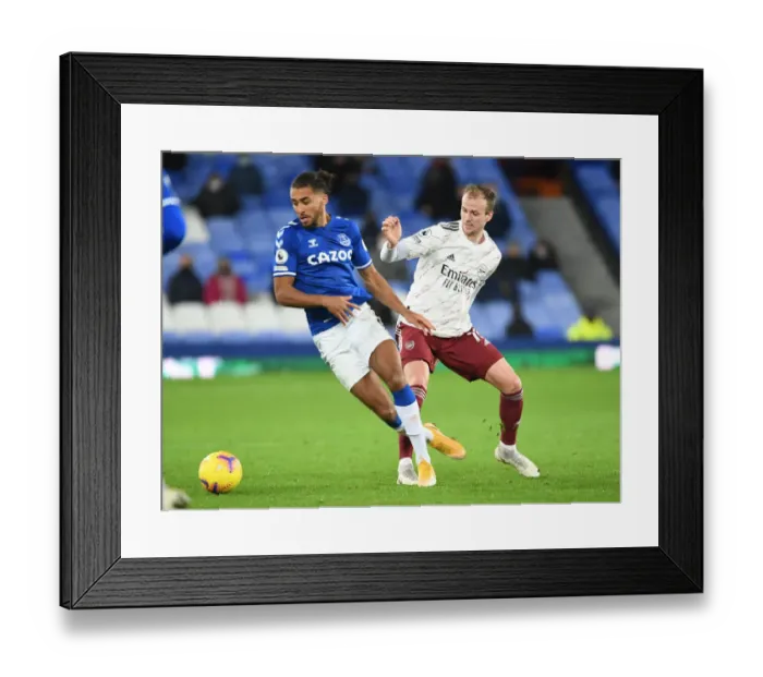 Framed Print : Clash at Goodison Park: Holding vs Calvert-Lewin in the Premier League Battle between Everton and Arsenal Framed Print : Clash at Goodison Park: Holding vs Calvert-Lewin in the Premier League Battle between Everton and Arsenal