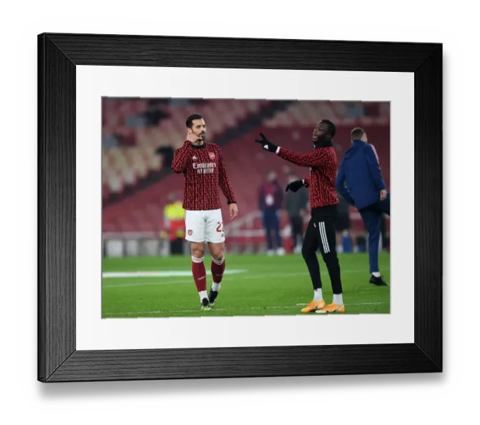 Framed Print : Arsenal's Pablo Mari and Nicolas Pepe in Pre-Match Preparation at Emirates Stadium: Carabao Cup Quarterfinal vs Manchester City