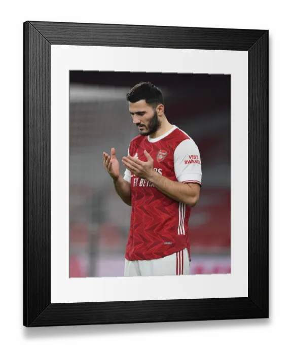 Framed Print : Arsenal's Sead Kolasinac Prepares for Carabao Cup Showdown Against Manchester City at Empty Emirates Stadium