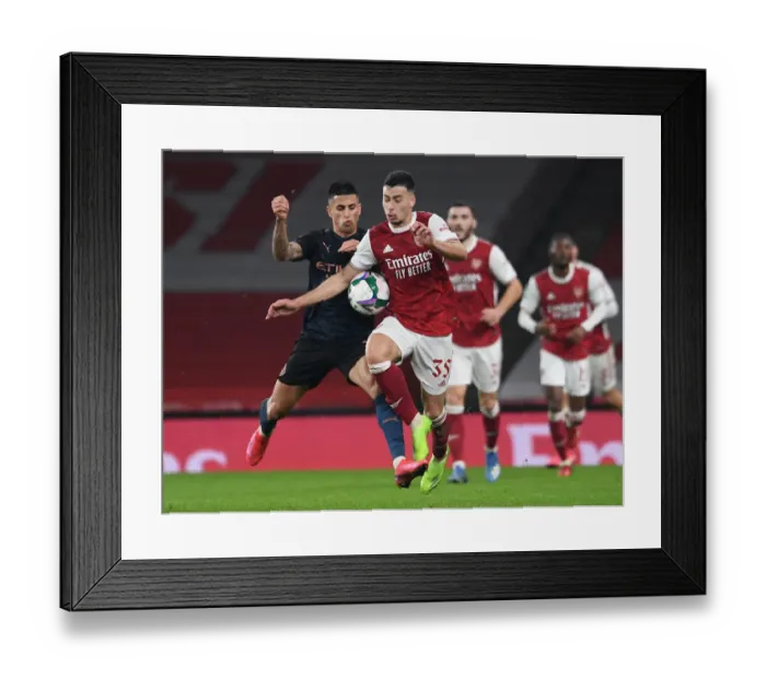 Framed Print : Carabao Cup Showdown: Arsenal vs Manchester City at Emirates Stadium - A Battle Between Giants