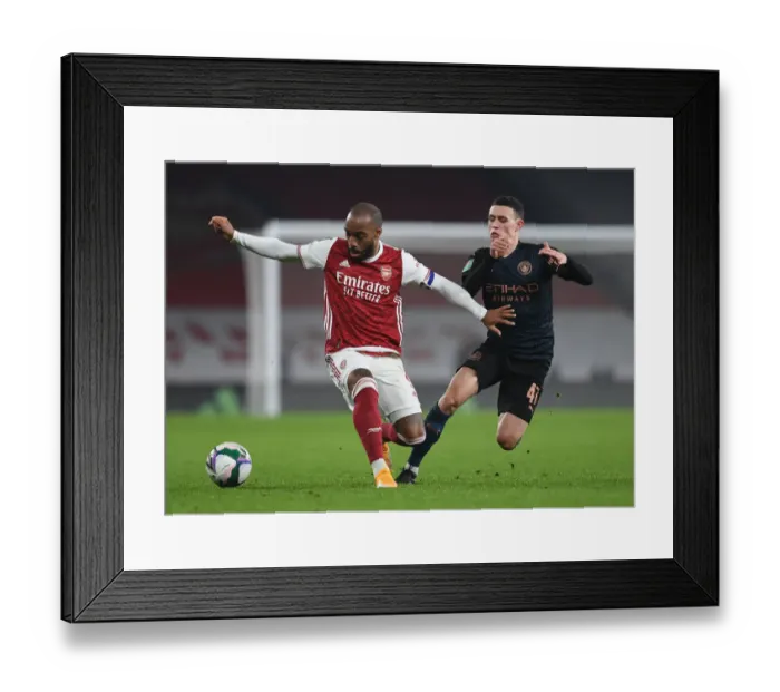 Framed Print : Arsenal vs Manchester City Rivalry: Lacazette vs Foden - Emirates Showdown in Empty Carabao Cup Quarterfinals