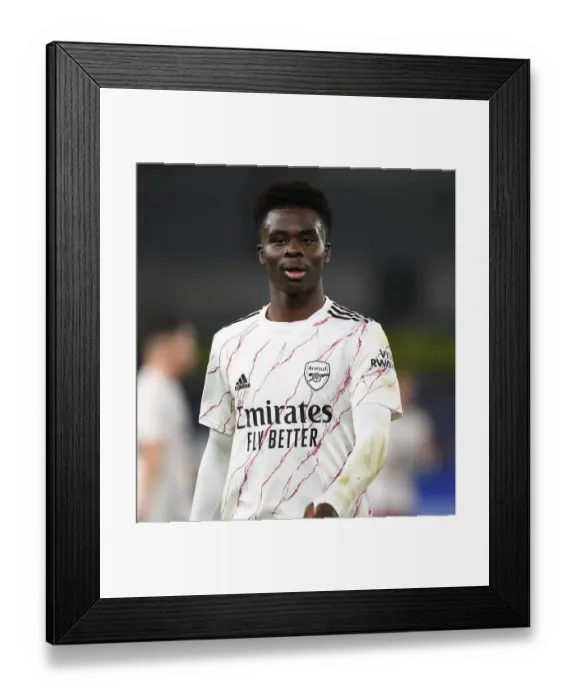 Framed Print : Arsenal's Bukayo Saka in Action: Arsenal vs. Brighton & Hove Albion, Premier League 2020-21 - Behind Closed Doors
