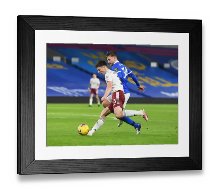 Framed Print : Arsenal's Kieran Tierney Faces Off Against Brighton's Joel Veltman in Empty American Express Community Stadium Framed Print : Arsenal's Kieran Tierney Faces Off Against Brighton's Joel Veltman in Empty American Express Community Stadium