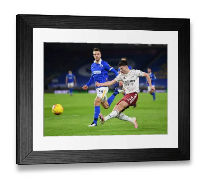 Framed Print : Arsenal's Kieran Tierney Faces Pressure from Brighton's Joel Veltman in Premier League Clash Framed Print : Arsenal's Kieran Tierney Faces Pressure from Brighton's Joel Veltman in Premier League Clash