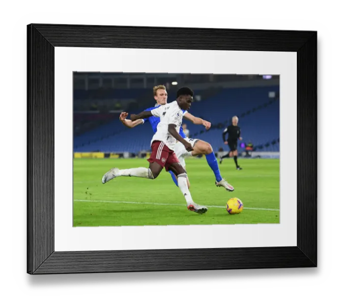Framed Print : Bukayo Saka Faces Off Against Dan Burn: Brighton vs. Arsenal, Premier League 2020-21