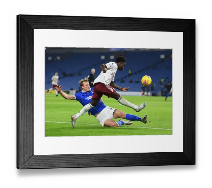Framed Print : Bukayo Saka vs Dan Burn: Intense Battle for Control - Arsenal vs Brighton, Premier League 2020-21