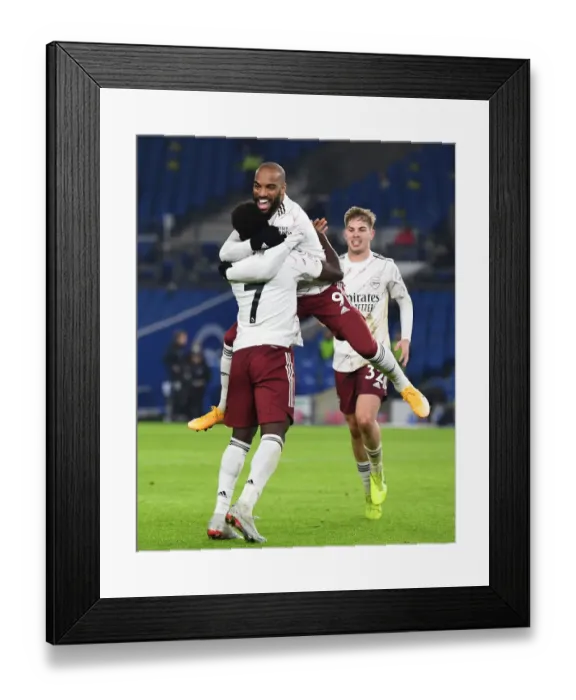 Framed Print : Arsenal: Lacazette and Saka's Jubilant Moment as They Celebrate Goal Against Brighton & Hove Albion, Premier League 2020-21