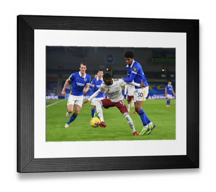 Framed Print : Ainsley Maitland-Niles Clashes with Bernardo in Arsenal's Premier League Battle at Brighton & Hove Albion