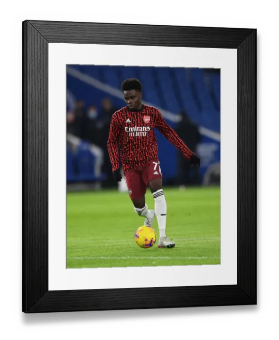 Framed Print : Arsenal's Bukayo Saka Warming Up Ahead of Brighton & Hove Albion Clash (Premier League 2020-21)