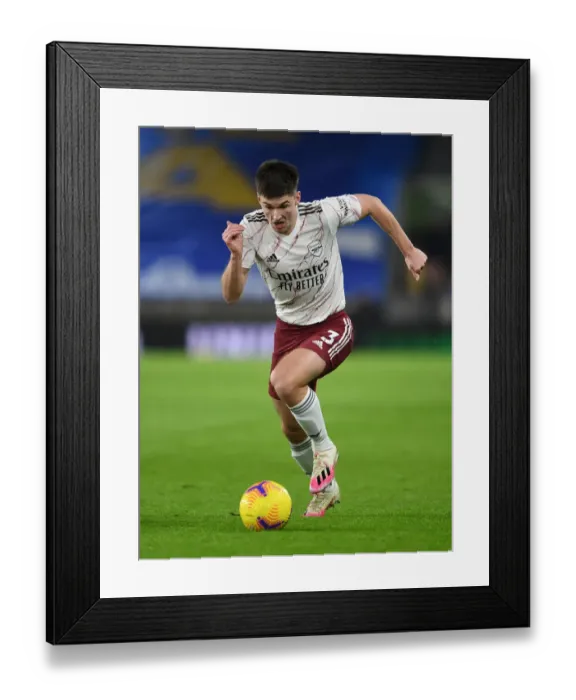 Framed Print : Arsenal's Kieran Tierney in Action against Brighton & Hove Albion in Premier League Clash (2020-21)