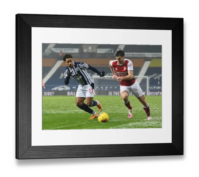 Framed Print : Arsenal's Kieran Tierney Outmaneuvers West Bromwich Albion's Matheus Pereira in Premier League Clash