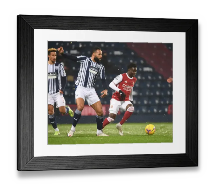 Framed Print : Arsenal's Bukayo Saka Outsmarts Kyle Bartley: Premier League Thriller Framed Print : Arsenal's Bukayo Saka Outsmarts Kyle Bartley: Premier League Thriller