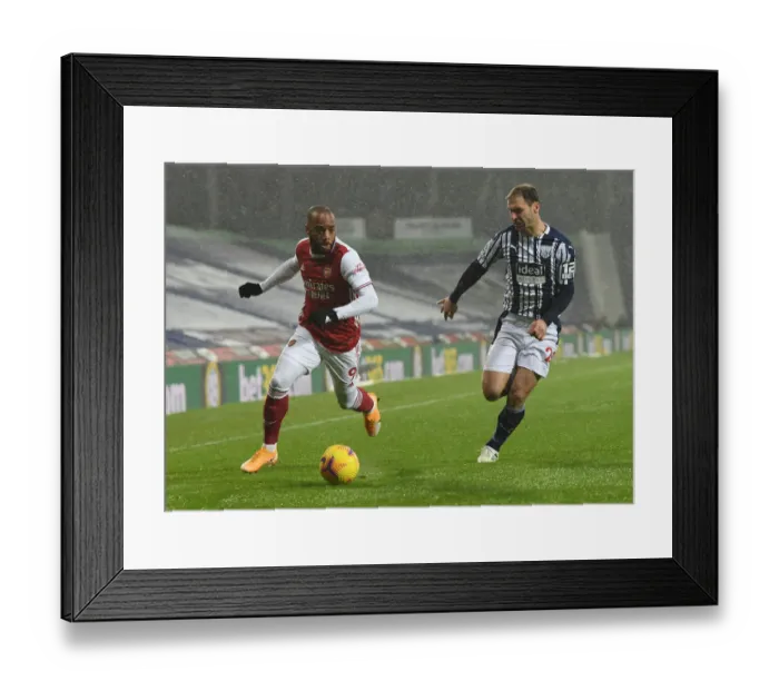 Framed Print : Arsenal's Lacazette Faces Off Against Ivanovic in West Bromwich Albion vs Arsenal Clash (2020-21) Framed Print : Arsenal's Lacazette Faces Off Against Ivanovic in West Bromwich Albion vs Arsenal Clash (2020-21)