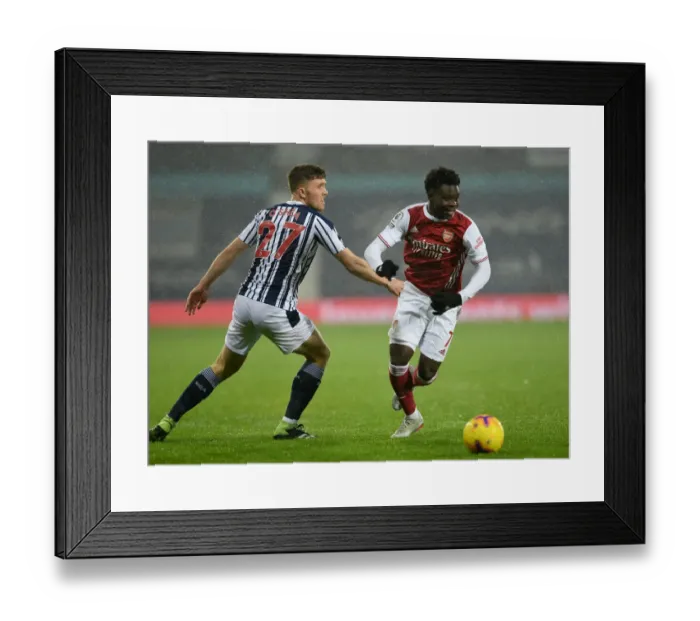 Framed Print : Bukayo Saka vs. Dara O'Shea: A Premier League Battle at The Hawthorns - Arsenal vs. West Bromwich Albion (2020-21)