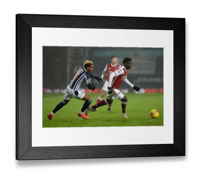 Framed Print : Bukayo Saka Faces Off Against Grady Diangana: West Bromwich Albion vs Arsenal, Premier League 2020-21