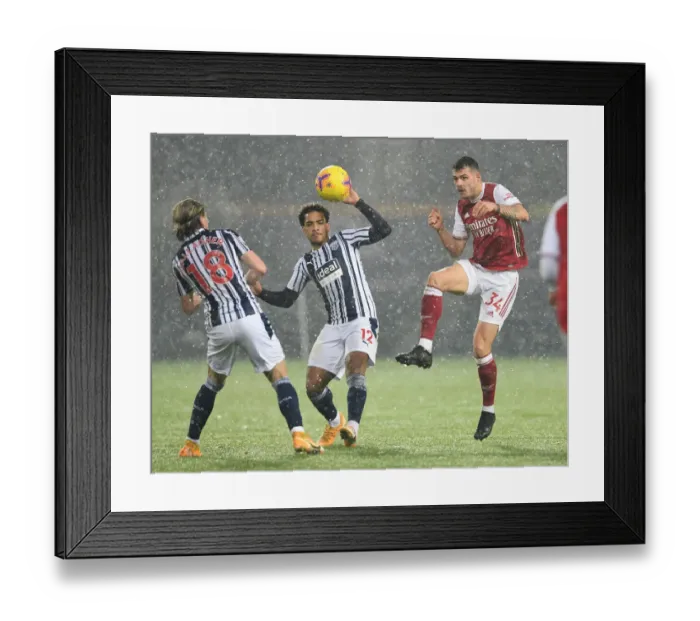 Framed Print : Xhaka Faces Off Against Diangana and Gallagher in Intense West Bromwich Albion vs Arsenal Clash