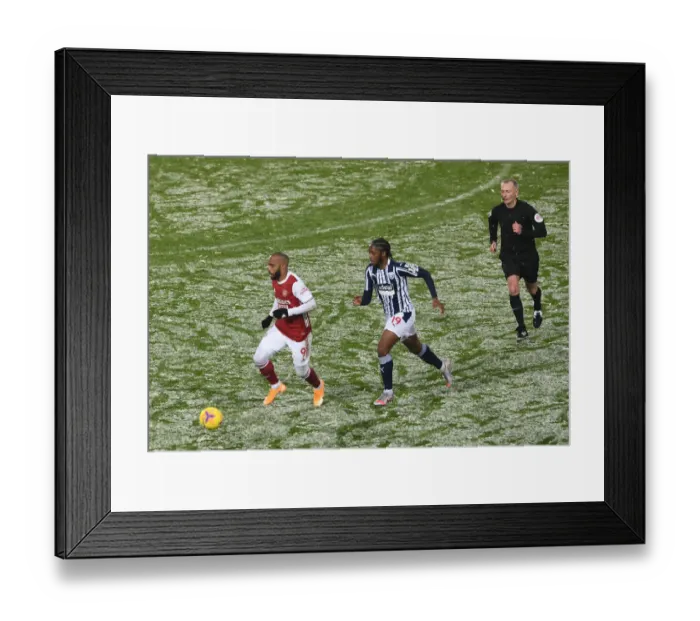 Framed Print : Arsenal's Lacazette Clashes with West Brom's Sawyers in Premier League Showdown