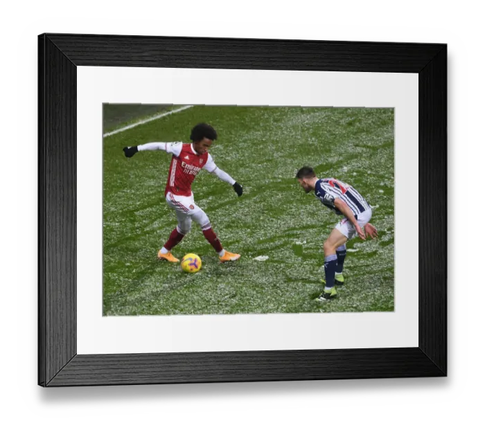 Framed Print : Willian vs Dara O'Shea: Intense Battle in West Bromwich Albion vs Arsenal Premier League Clash