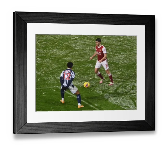 Framed Print : Arsenal's Kieran Tierney Clashes with Matheus Pereira in West Bromwich Albion vs Arsenal Premier League Match