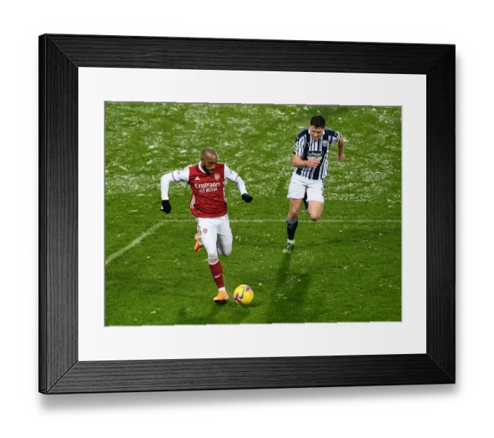 Framed Print : Alexandre Lacazette Faces Off Against Dara O'Shea in West Bromwich Albion vs Arsenal Premier League Clash