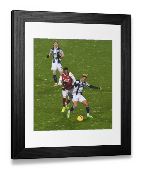 Framed Print : Arsenal's Joe Willock Clashes with West Bromwich Albion's Callum Robinson in Premier League Showdown