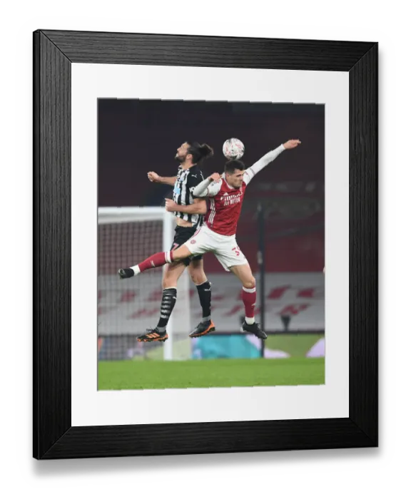 Framed Print : Xhaka vs. Carroll: Empty Emirates FA Cup Clash Framed Print : Xhaka vs. Carroll: Empty Emirates FA Cup Clash