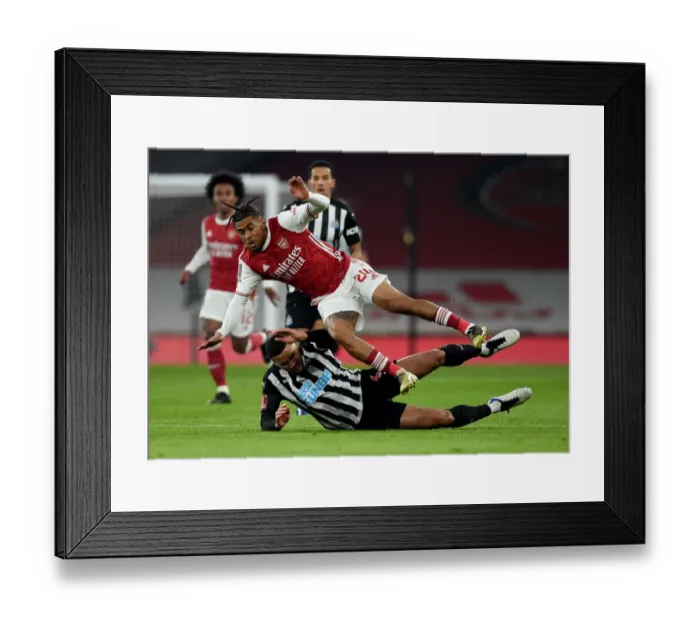 Framed Print : Arsenal vs Newcastle United: FA Cup Clash - Reiss Nelson vs Jamaal Lascelles