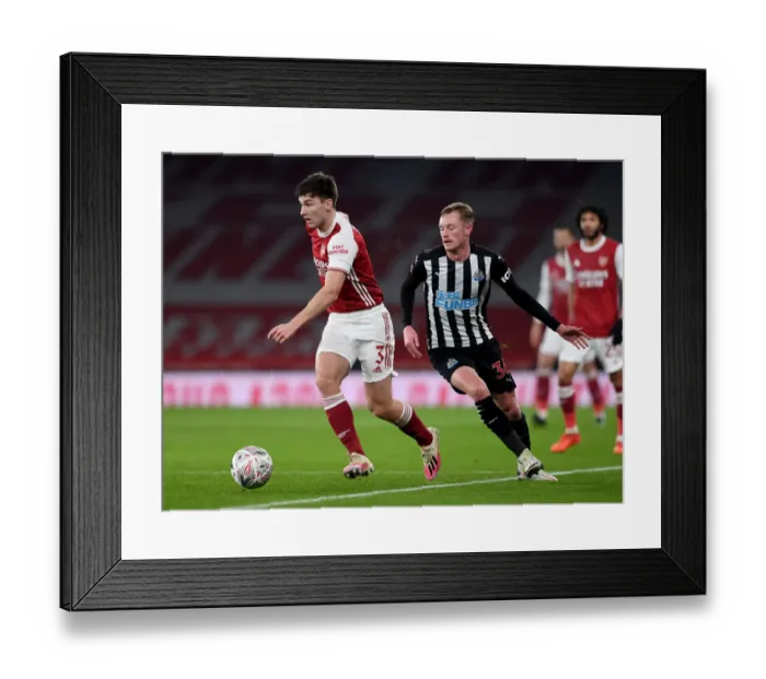 Framed Print : Arsenal's Kieran Tierney Tackles Newcastle's Sean Longstaff in FA Cup Clash