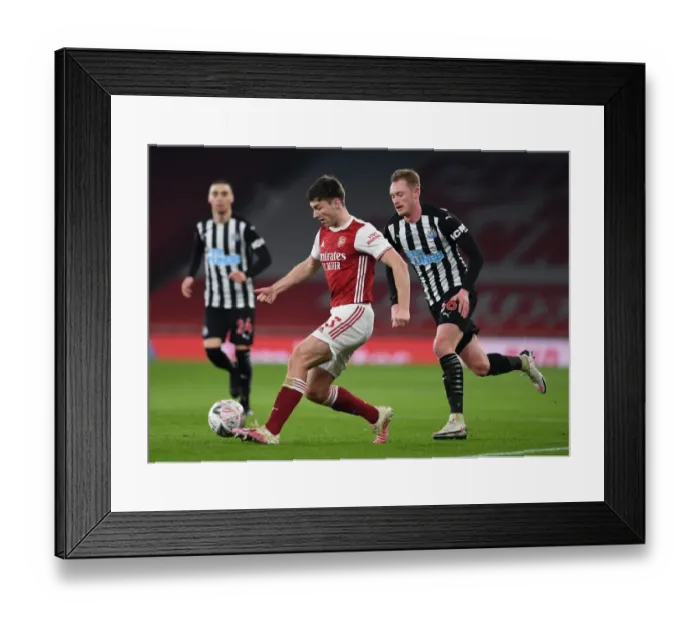Framed Print : Arsenal vs Newcastle United: Kieran Tierney Tackles Sean Longstaff in FA Cup Clash