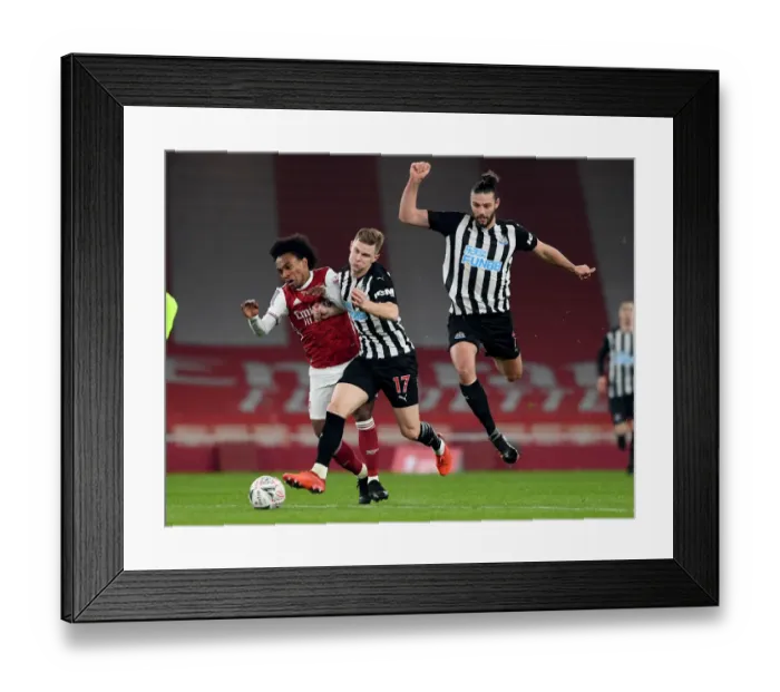 Framed Print : Arsenal vs Newcastle United: FA Cup Clash Marred by Foul on Willian Framed Print : Arsenal vs Newcastle United: FA Cup Clash Marred by Foul on Willian