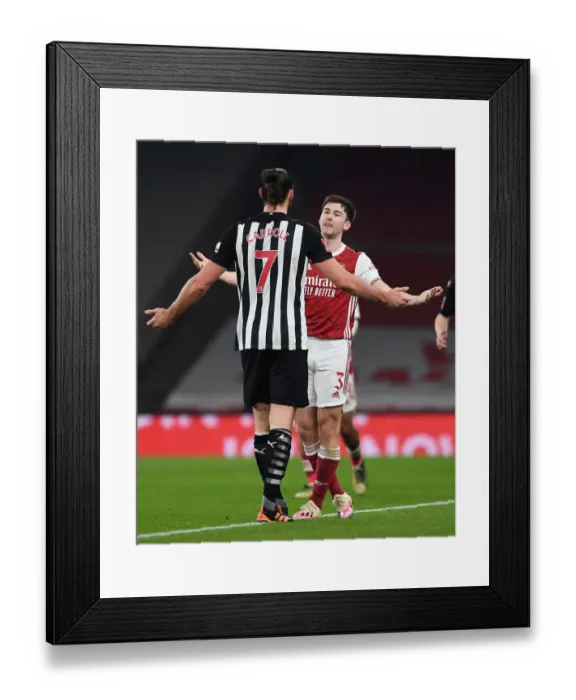 Framed Print : Arsenal's Kieran Tierney Confronts Newcastle's Andy Carroll During FA Cup Clash Framed Print : Arsenal's Kieran Tierney Confronts Newcastle's Andy Carroll During FA Cup Clash