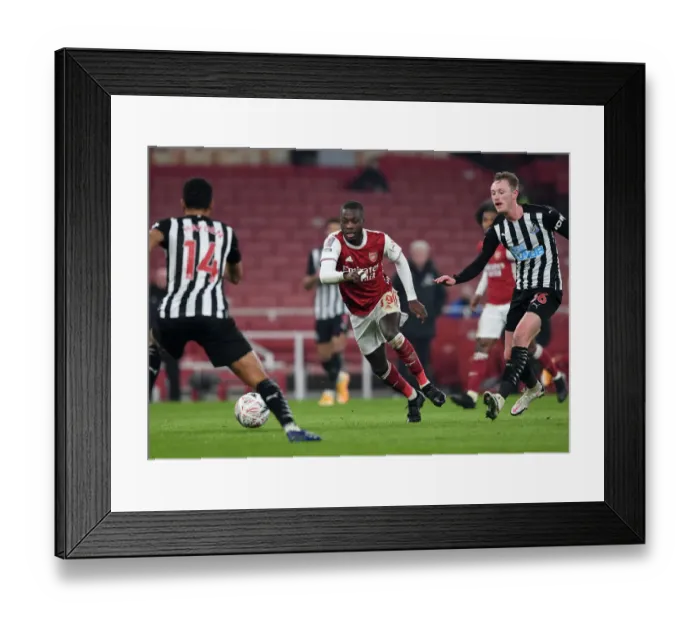 Framed Print : Arsenal's Nicolas Pepe in Action during FA Cup Third Round Match against Newcastle United Framed Print : Arsenal's Nicolas Pepe in Action during FA Cup Third Round Match against Newcastle United