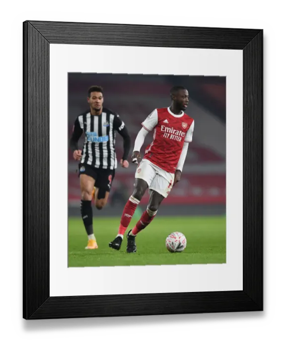 Framed Print : Arsenal's Nicolas Pepe in Action: FA Cup Third Round Clash Against Newcastle United Framed Print : Arsenal's Nicolas Pepe in Action: FA Cup Third Round Clash Against Newcastle United