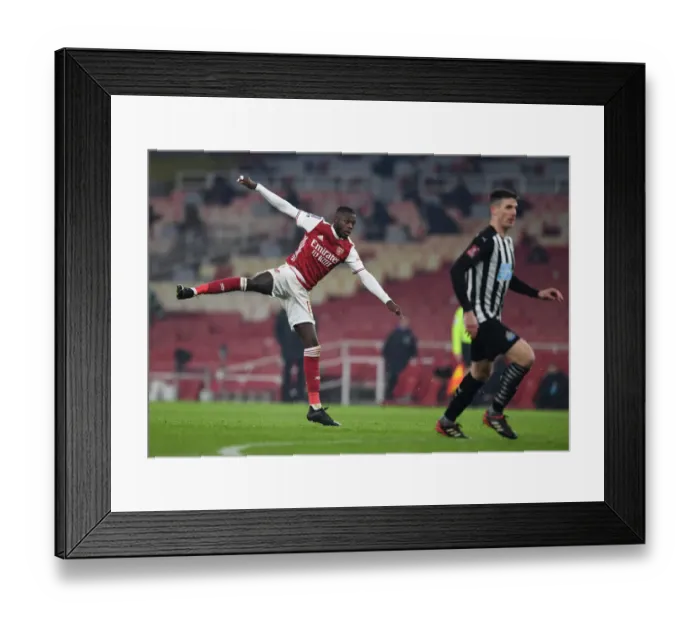 Framed Print : Arsenal's Nicolas Pepe in Action against Newcastle United in FA Cup Third Round