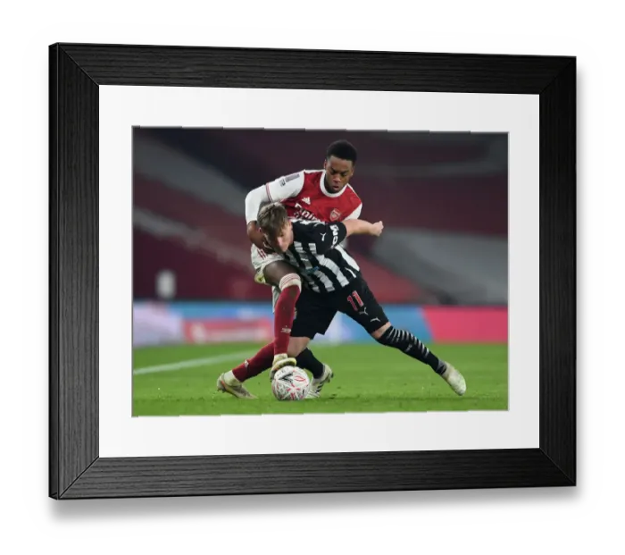 Framed Print : Arsenal vs Newcastle United: FA Cup Clash - Joe Willock Challenges Matt Ritchie