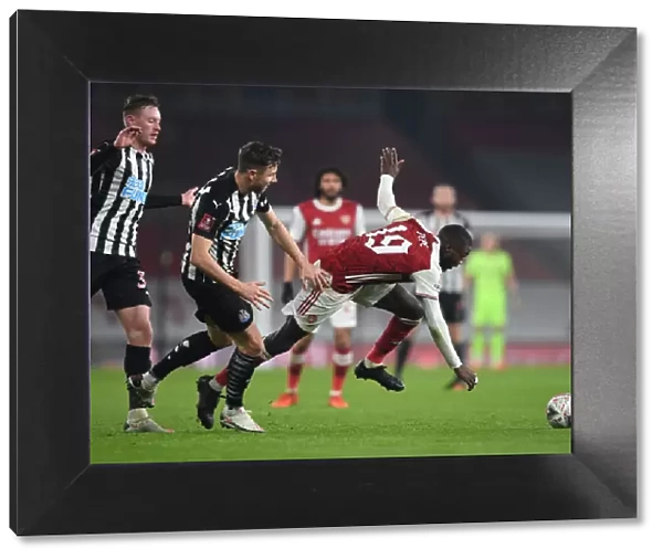 Arsenal's Nicolas Pepe Faces Off Against Newcastle's Paul Dummett in FA Cup Clash