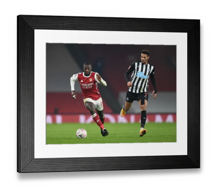 Framed Print : Arsenal vs Newcastle United: Pepe vs Joelinton Clash in FA Cup Third Round
