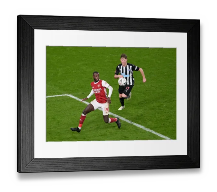 Framed Print : Arsenal vs Newcastle United: Pepe Faces Off Against Ritchie in FA Cup Clash