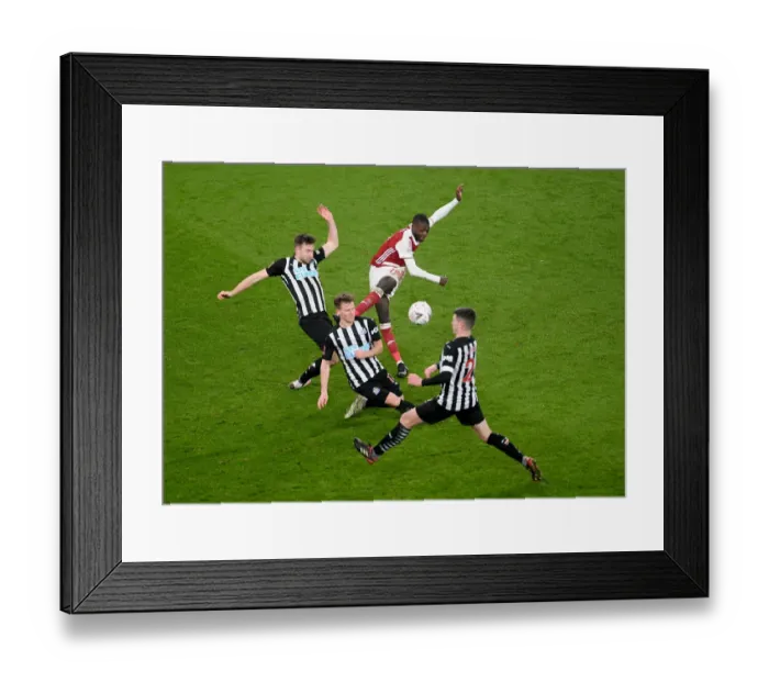 Framed Print : Intense Defensive Pressure: Arsenal's Nicolas Pepe Faces Off Against Newcastle's Triple Threat in FA Cup Clash Framed Print : Intense Defensive Pressure: Arsenal's Nicolas Pepe Faces Off Against Newcastle's Triple Threat in FA Cup Clash