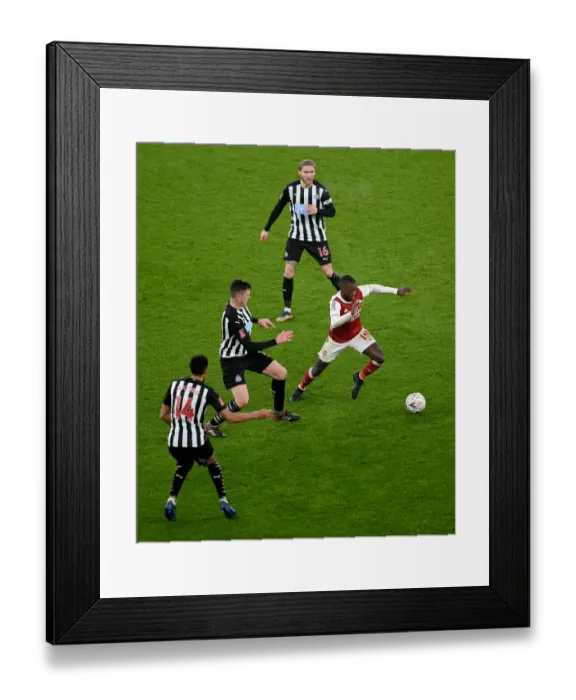 Framed Print : Arsenal's Nicolas Pepe Clashes with Newcastle's Ciaran Clark in FA Cup Third Round