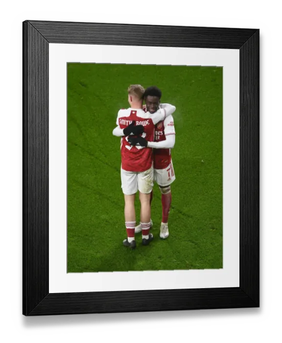 Framed Print : Arsenal's Smith Rowe and Saka Celebrate First Goal in FA Cup Victory over Newcastle Framed Print : Arsenal's Smith Rowe and Saka Celebrate First Goal in FA Cup Victory over Newcastle