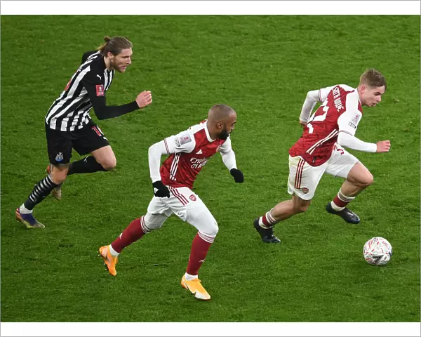Arsenal's Smith Rowe and Lacazette Sprint Past Newcastle's Hendrick in FA Cup Clash