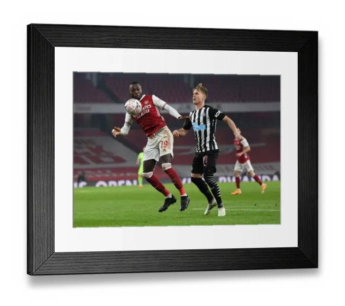 Framed Print : Pepe vs Ritchie: FA Cup Clash at Arsenal - Arsenal vs Newcastle United (2020-21)