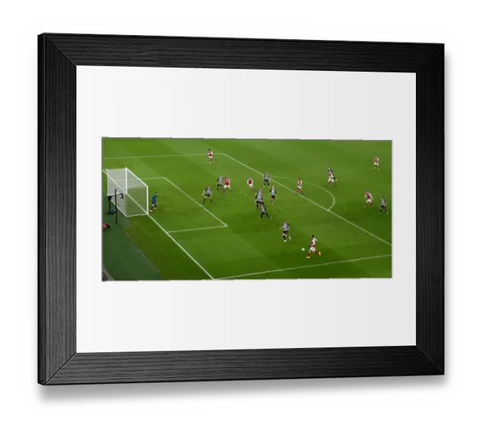 Framed Print : Arsenal's Aubameyang Crosses for FA Cup Win against Newcastle