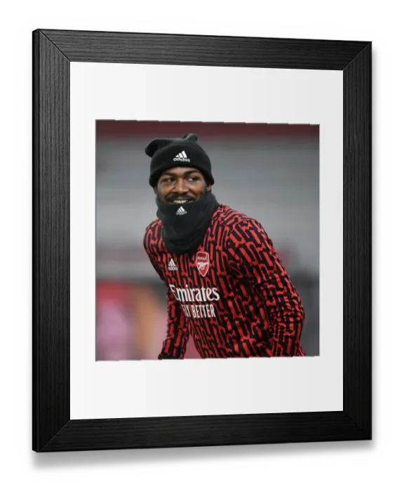 Framed Print : Arsenal's Ainsley Maitland-Niles Prepares for Palace Clash Amid Empty Emirates Stadium (Arsenal v Crystal Palace, 2021)