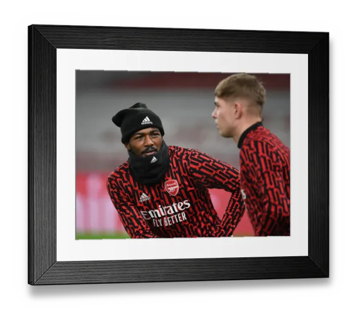 Framed Print : Arsenal's Ainsley Maitland-Niles Warms Up Ahead of Empty Emirates Stadium for Arsenal v Crystal Palace (2021) Framed Print : Arsenal's Ainsley Maitland-Niles Warms Up Ahead of Empty Emirates Stadium for Arsenal v Crystal Palace (2021)