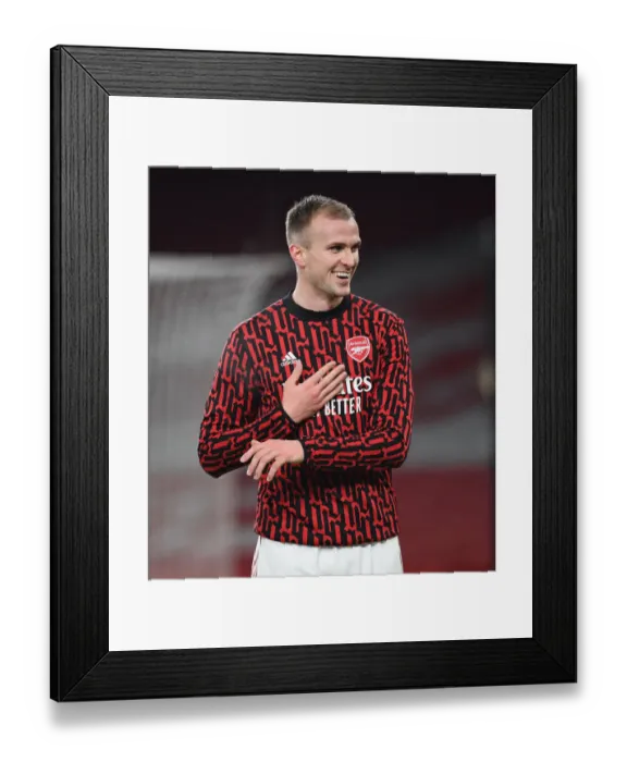 Framed Print : Arsenal's Rob Holding Prepares for Palace Clash in Empty Emirates Stadium (Arsenal v Crystal Palace, 2021)