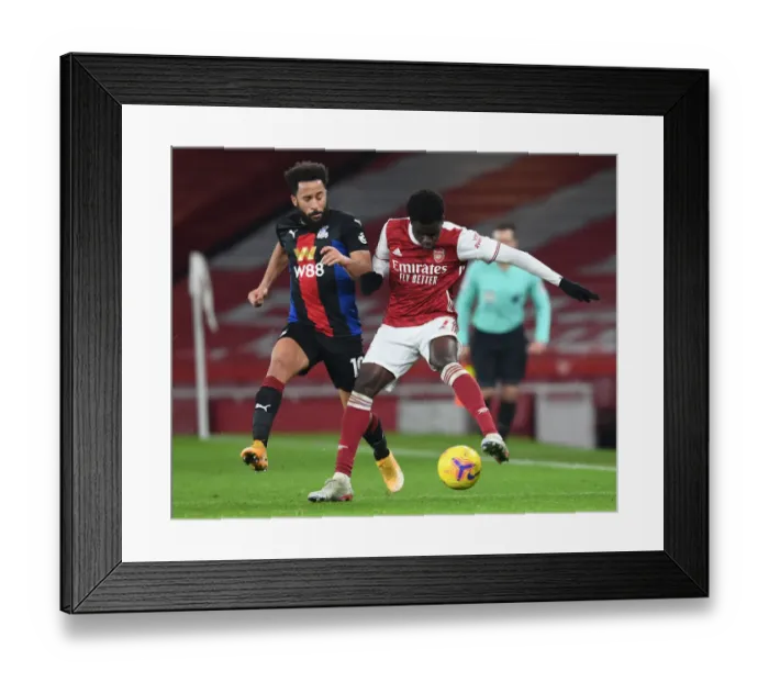 Framed Print : Arsenal's Bukayo Saka in Action: Premier League Clash Against Crystal Palace at Empty Emirates Stadium, 2020-21