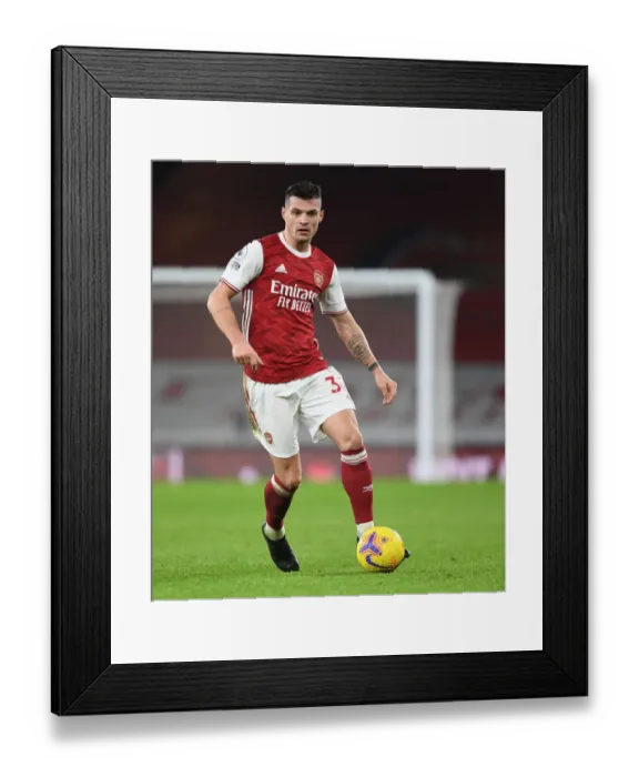 Framed Print : Arsenal's Granit Xhaka in Action at Emptied-Out Emirates Against Crystal Palace (Premier League 2020-21) Framed Print : Arsenal's Granit Xhaka in Action at Emptied-Out Emirates Against Crystal Palace (Premier League 2020-21)